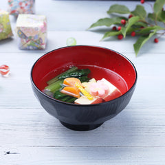 bowl of miso soup made with TOMOSAN yuzu dashi, bright citrus aroma and clear broth