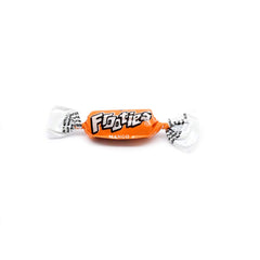Tootsie Roll open bag spilling mango candies to show quantity and grab-and-go benefit