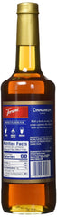 Torani cinnamon syrup pouring into latte, adds warm cassia flavor and smooth sweetness