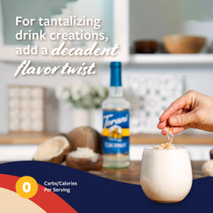 Torani syrup pouring into coffee to add coconut flavor and creamy taste