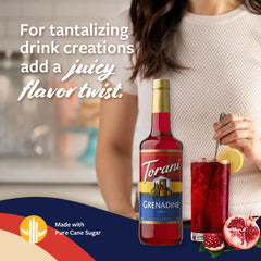 Torani grenadine creating a red swirl in cocktail for visual appeal