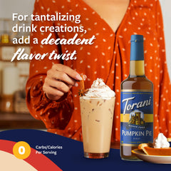 Barista pouring Torani Pumpkin Pie syrup into a latte to add seasonal flavor quickly