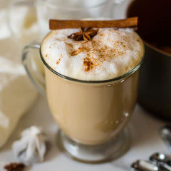 Torani Puremade caramel pouring into a coffee cup, adding caramel flavor without sugar