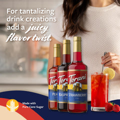 Torani raspberry bottle close-up emphasizing rich hue and fresh fruit taste