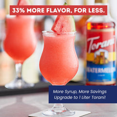 Torani watermelon syrup pouring into a glass, adding vibrant color and sweet flavor