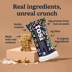 Tosi unwrapped cashew coconut bar revealing crunchy clusters and seeds