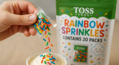 TOSS opened packet pouring colorful sprinkles onto dessert for instant decoration