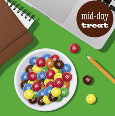 TREATBASKET M&M Peanut Butter in a bowl at a party table offering colorful snack appeal