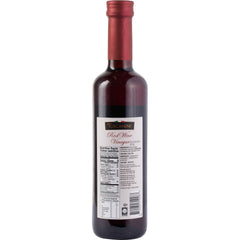 Tuscanini bottle next to apples to show 16.9oz scale and portioning