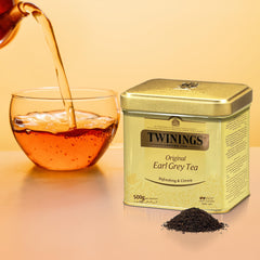 Twinings tin open with spoonful of leaves, easy scoop and portioning