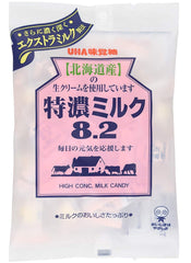 UHA Mikakutou candies in a purse and on a desk, demonstrating portability and convenient everyday snacking