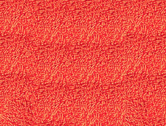 Unpretentious close-up of red jimmies texture showing soft candy strands