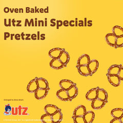 Utz mini pretzels held in hand showing crunch and portable benefit
