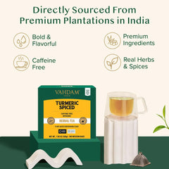 VAHDAM cup of steeped turmeric ginger cinnamon tea emitting warm steam, ready to sip