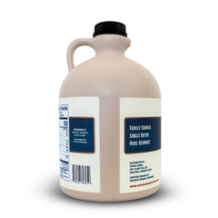 Vermont Maple Syrup pour closeup amber stream highlighting smooth texture