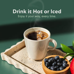 Pile of Guatemalan beans next to VitaCup label emphasizing single-origin high-altitude quality