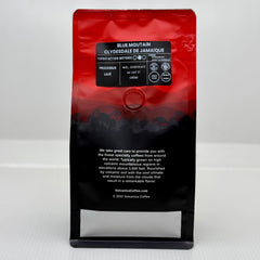 Volcanica beans pouring into a grinder demonstrating grind-fresh flavor advantage