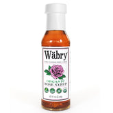 Wabry bottle front label showing organic rose syrup, clear branding and benefits