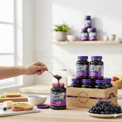 WeIch$ grape jelly spread on toast demonstrating easy use for breakfast