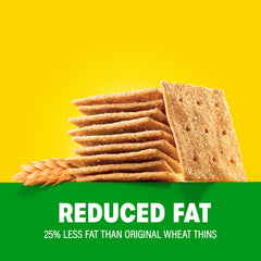 Wheat Thins topped with cheese on a cutting board for pairing ideas