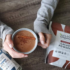 Wildly Organic scoop with powder showing portion size and bulk value benefit