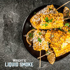 Cooked ribs glazed with Wright's Liquid Smoke applewood highlighting rich barbecue flavor