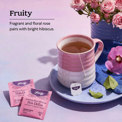 Steaming brewed cup of Yogi rose hibiscus tea, offering a calming fragrant sip