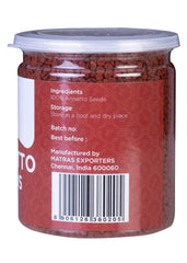 Yogi's Gift annatto-infused oil poured to show vibrant color and cooking benefit
