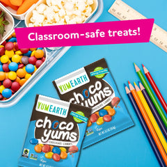 YumEarth choco yums next to ruler to show compact size and portability benefit