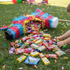 Yummy Chew candies spilling into a piñata ready for party excitement
