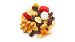 Yupik closeup of raisins, papaya, nuts and coated peanuts highlighting texture