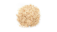 Yupik close-up texture of almond powder showing fine grain and natural skins for texture