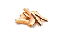 Yupik coconut smiles in a bowl as a topping, showing versatile serving inspiration