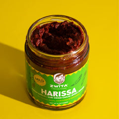 Zwïta close-up texture of mild harissa highlighting sun-dried chili and garlic