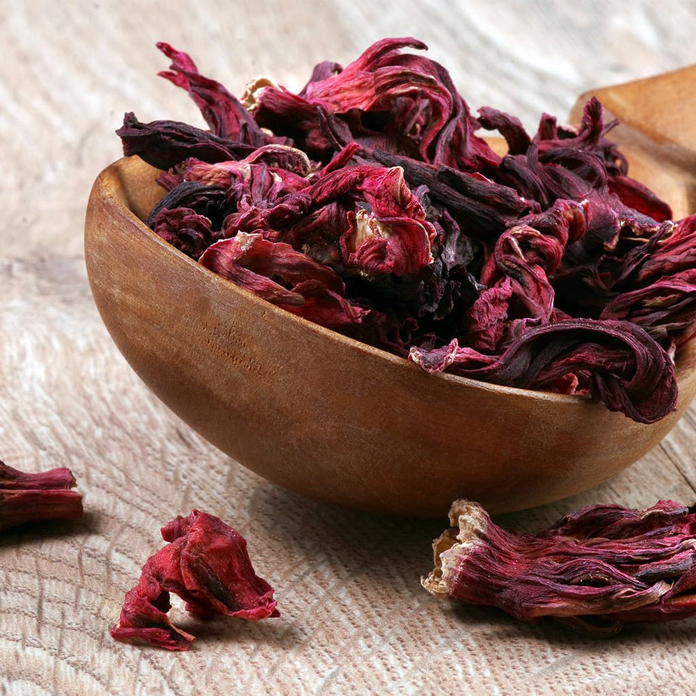 1400S SPICES brewed hibiscus tea in glass jug highlighting vibrant color and refreshment