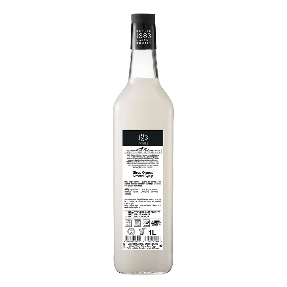 1883 MAISON ROUTIN label closeup highlighting almond flavor and French origin benefit