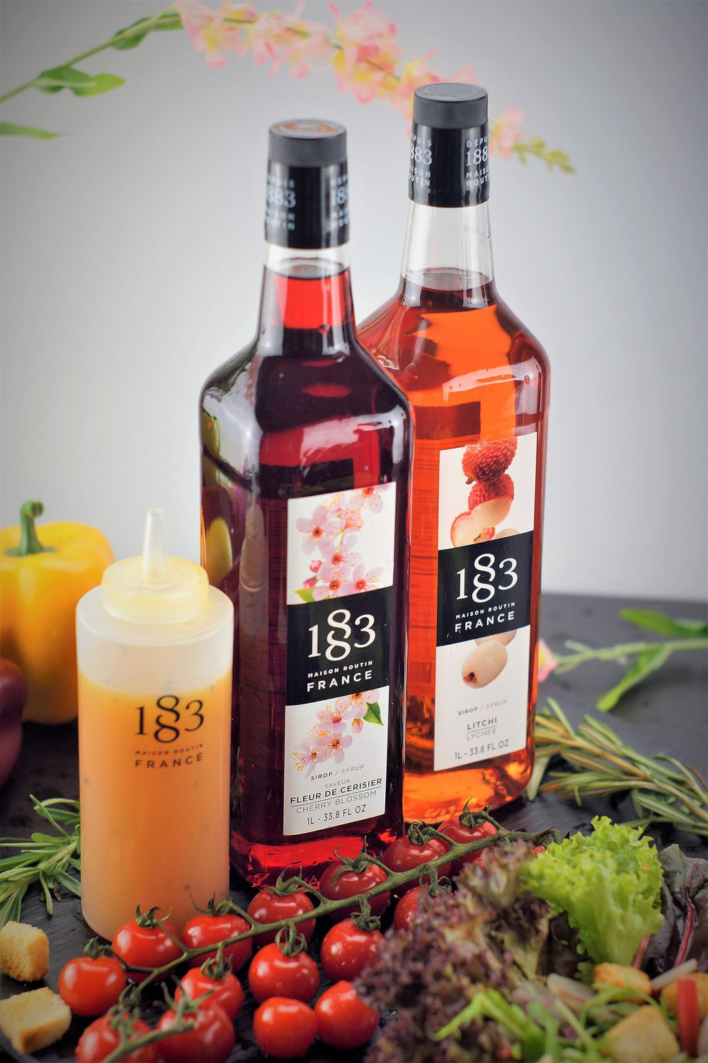 1883 Maison Routin salted caramel iced coffee lifestyle shot, suggesting cafe-quality taste