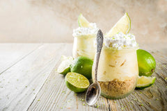 A Blend Above prepared key lime pie in crust, showcasing creamy filling and vibrant color
