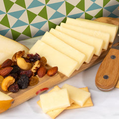 A Gift Inside Gouda cheese wedge detail highlighting creamy texture and pairing benefit