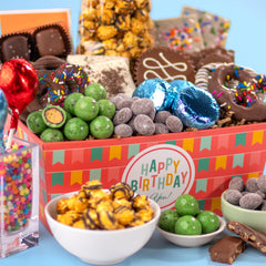 A Gift Inside basket in a party setting with treats arranged to delight guests