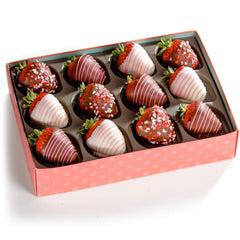 A Gift Inside top view of twelve arranged berries highlighting decorative drizzles