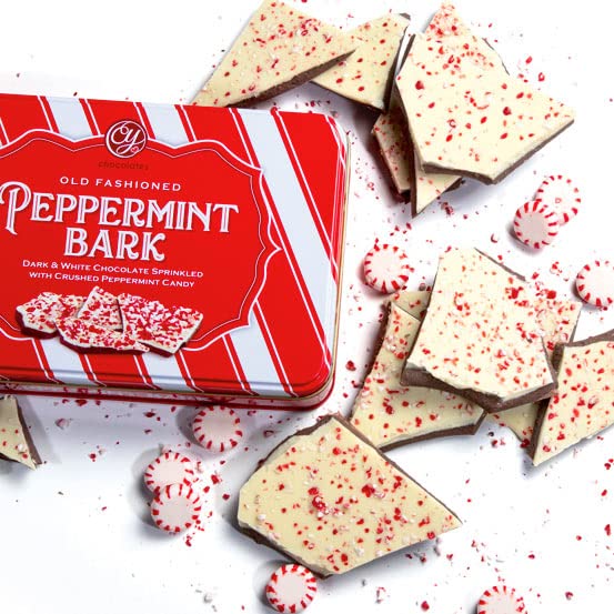 A Gift Inside open tin with stacked peppermint bark squares ready to serve