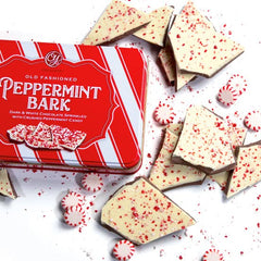 A Gift Inside open tin with stacked peppermint bark squares ready to serve
