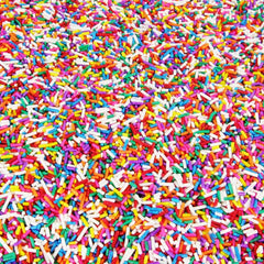 A Great Surprise sprinkles on frosted cupcake adding instant party-ready color and texture