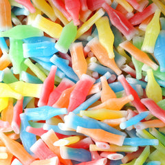 Assorted A Great Surprise wax bottles spread on table showing color variety and convenience
