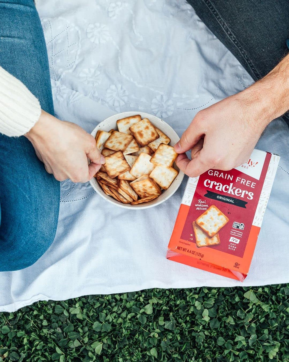 Absolutely crackers topped with cheese and hummus for versatile pairing