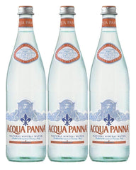 Acqua Panna glass bottle front view on table, elegant presentation