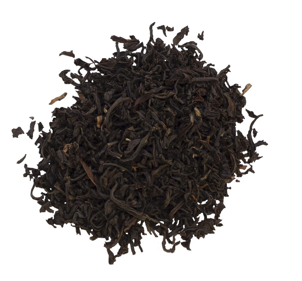 Ahmad Tea label and origin text highlighting Assam source and award pedigree