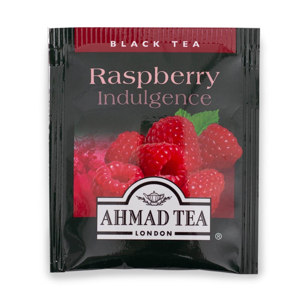 Ahmad Tea close-up of raspberry pieces and black tea leaves highlighting real fruit inclusion