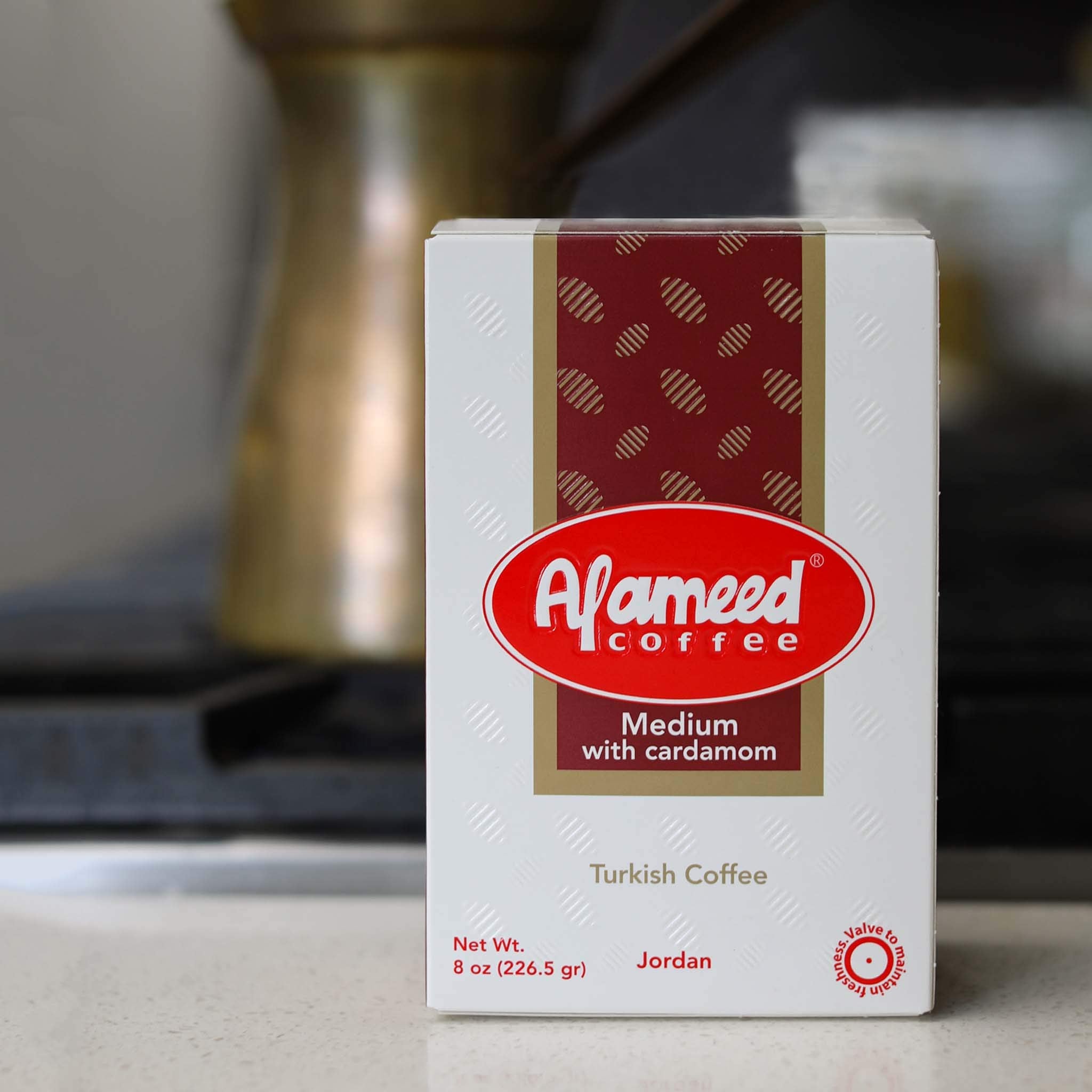 Al Ameed label close-up showing ingredients and roast profile benefit